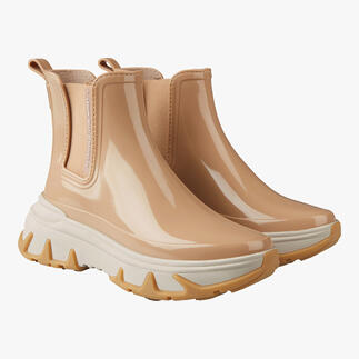 Beige Chelsea sneakerboots im Paar.
