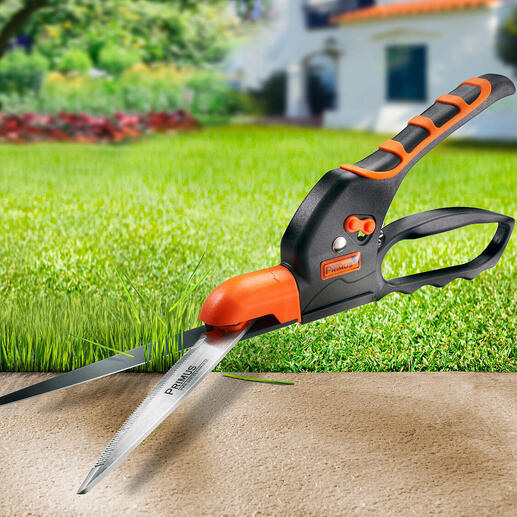 Zahnschneider mit orangefarbenem Griff schneidet Rasenrand.