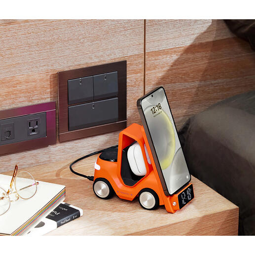 Orange Oranger Qi-Lade-Stapler mit aufgeladenem Smartphone und digitaler Uhranzeige.