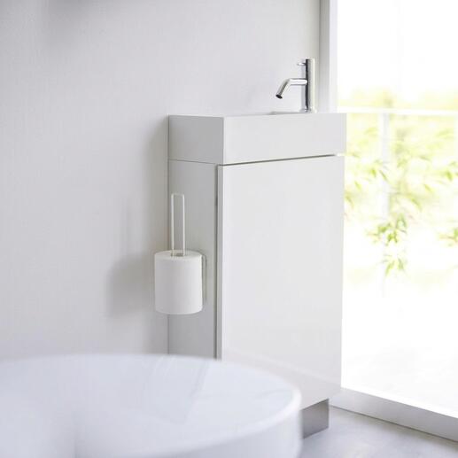 Weißer Design WC-Rollenhalter an einem modernen Badezimmermöbel angebracht.