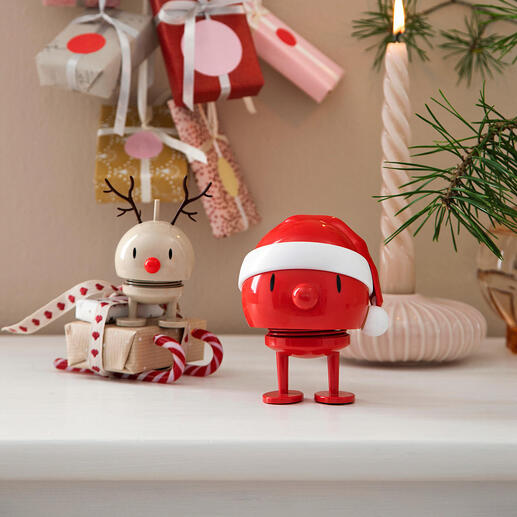 Hoptimist Schneemann in der Weihnachtsdekoration mit Geschenken.