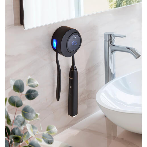 UV-Zahnbürsten Desinfektionsstation an der Wand mit schwarzem Design und LED-Anzeige.