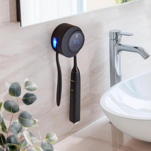 UV-Zahnbürsten Desinfektionsstation an der Wand mit schwarzem Design und LED-Anzeige.