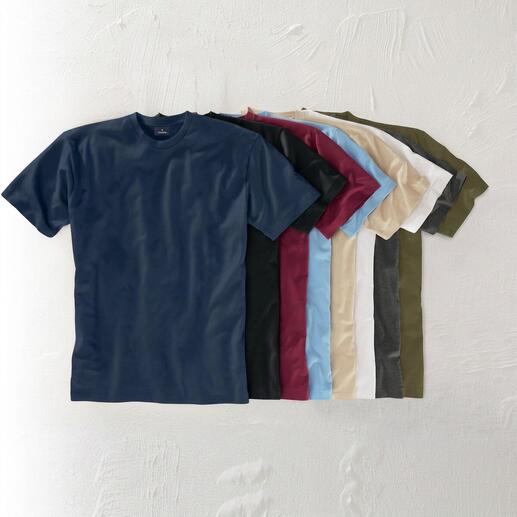 Verschiedene Farben von Das 155 g-Ragman T-Shirt auf einem Tisch.