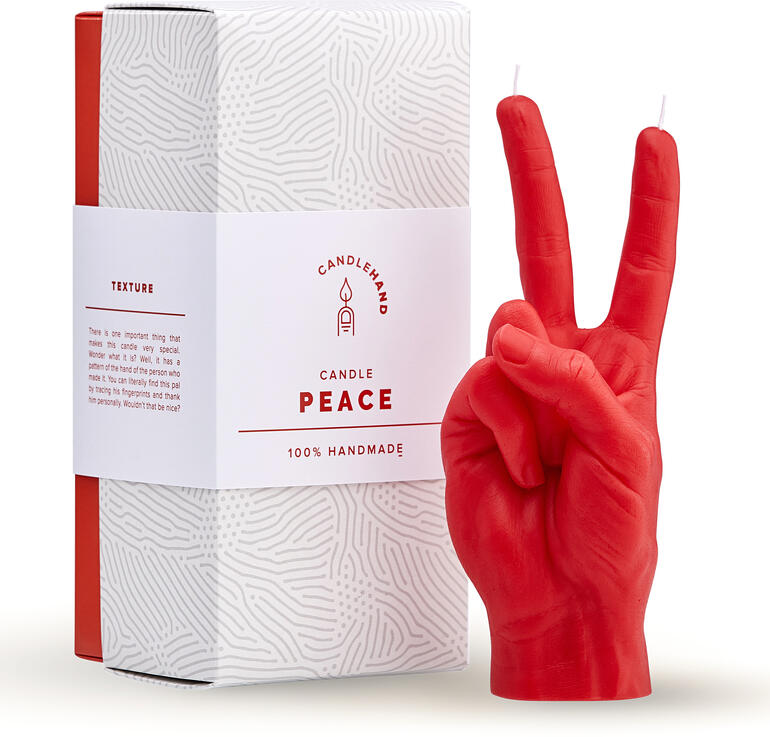 Rote Handgestenkerze 'Peace' mit Verpackung.