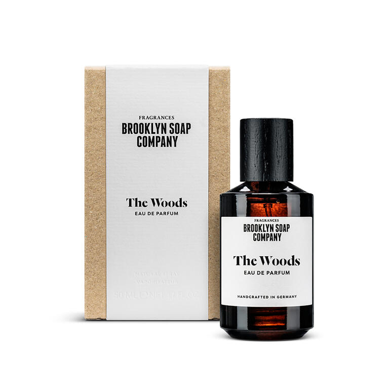 Flasche des Dufts 'The Woods' mit edler Verpackung.