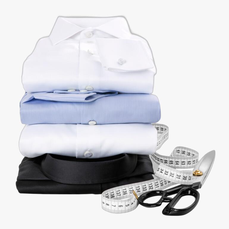 Gestapelte Hemden in verschiedenen Farben für Maßanfertigungen