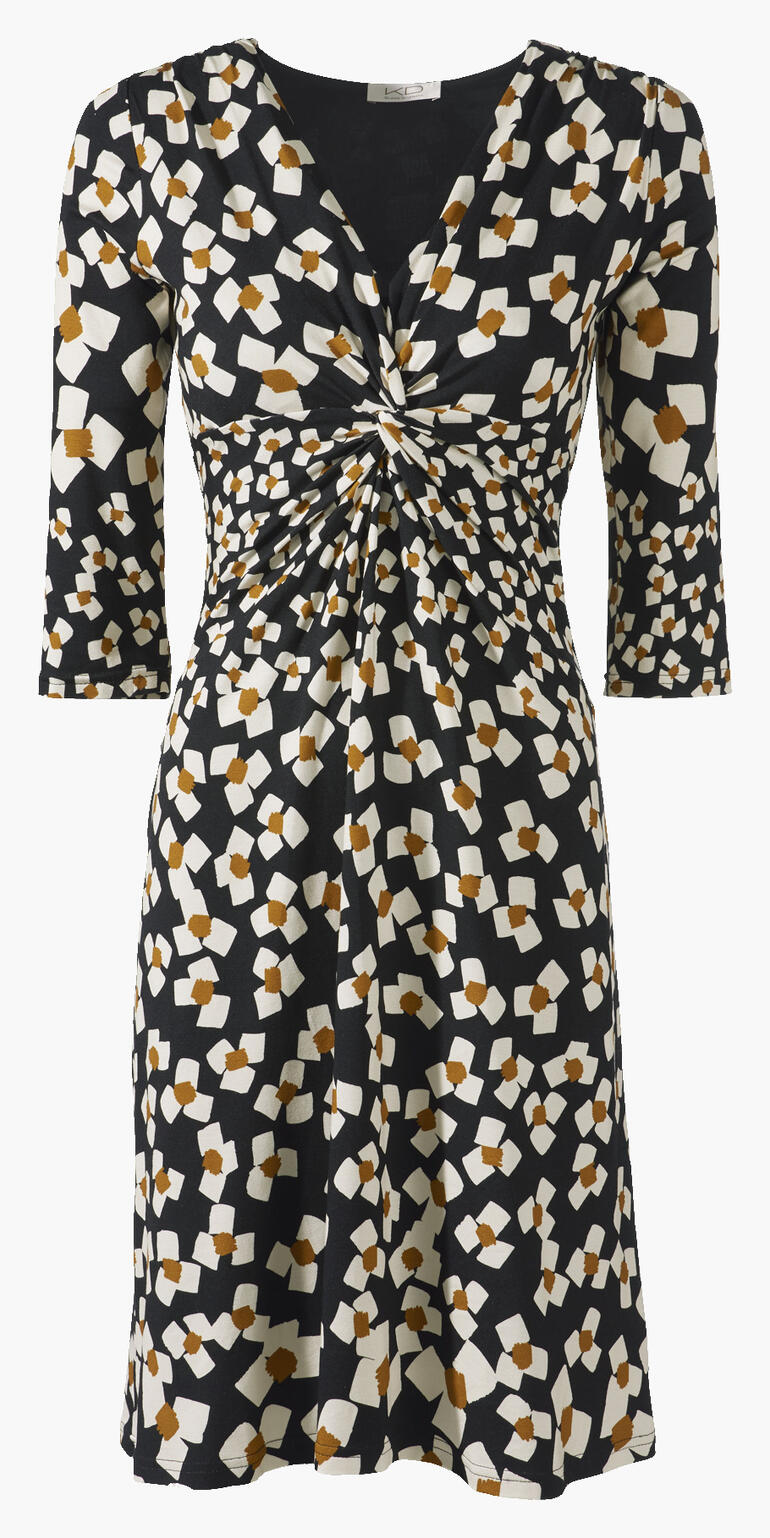 Frontansicht eines schwarz-weißen Jerseykleids mit abstrakten Blumen und elastischer Taillierung.