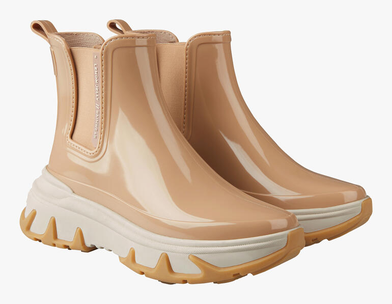 Beige Chelsea sneakerboots im Paar.