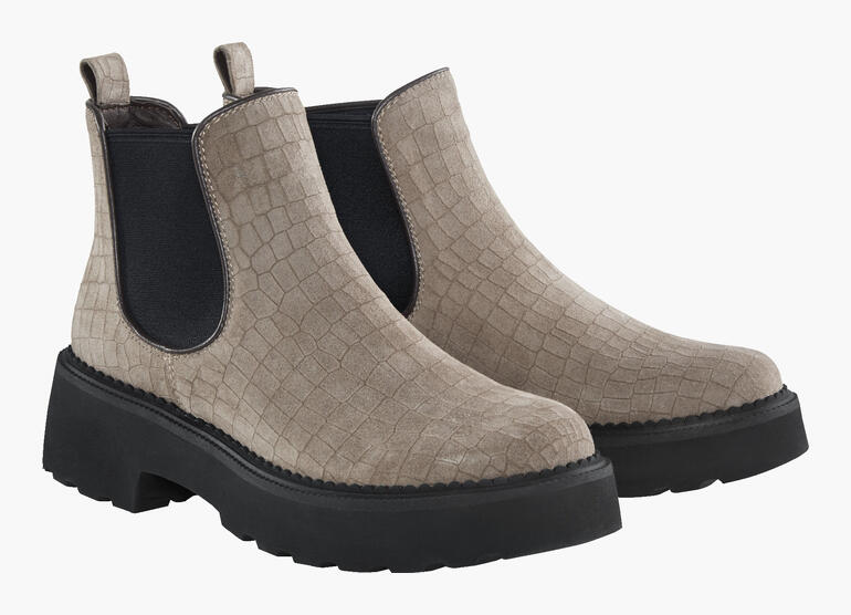 Zwei beige Chelsea-Boots nebeneinander, mit strukturierter Oberfläche.
