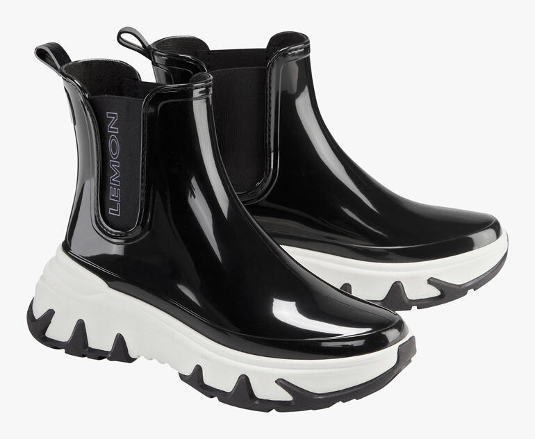 Schwarze und weiße Lemon Jelly Chelsea-Sneakerboots mit glänzender Oberfläche.