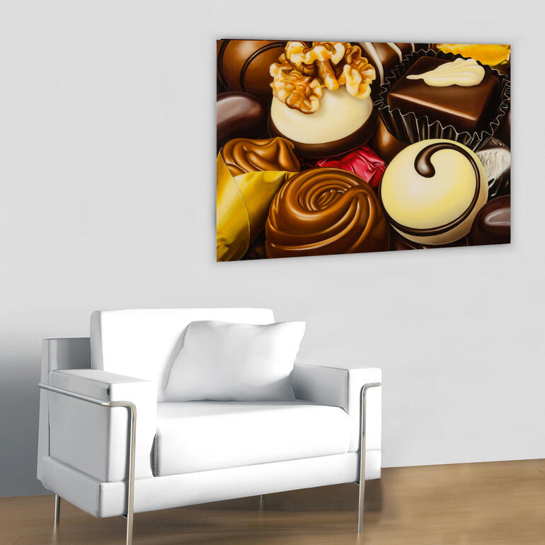 Die Pralinen sind so realistisch gemalt, dass man erst auf den zweiten Blick erkennt, dass es keine Fotografie ist.